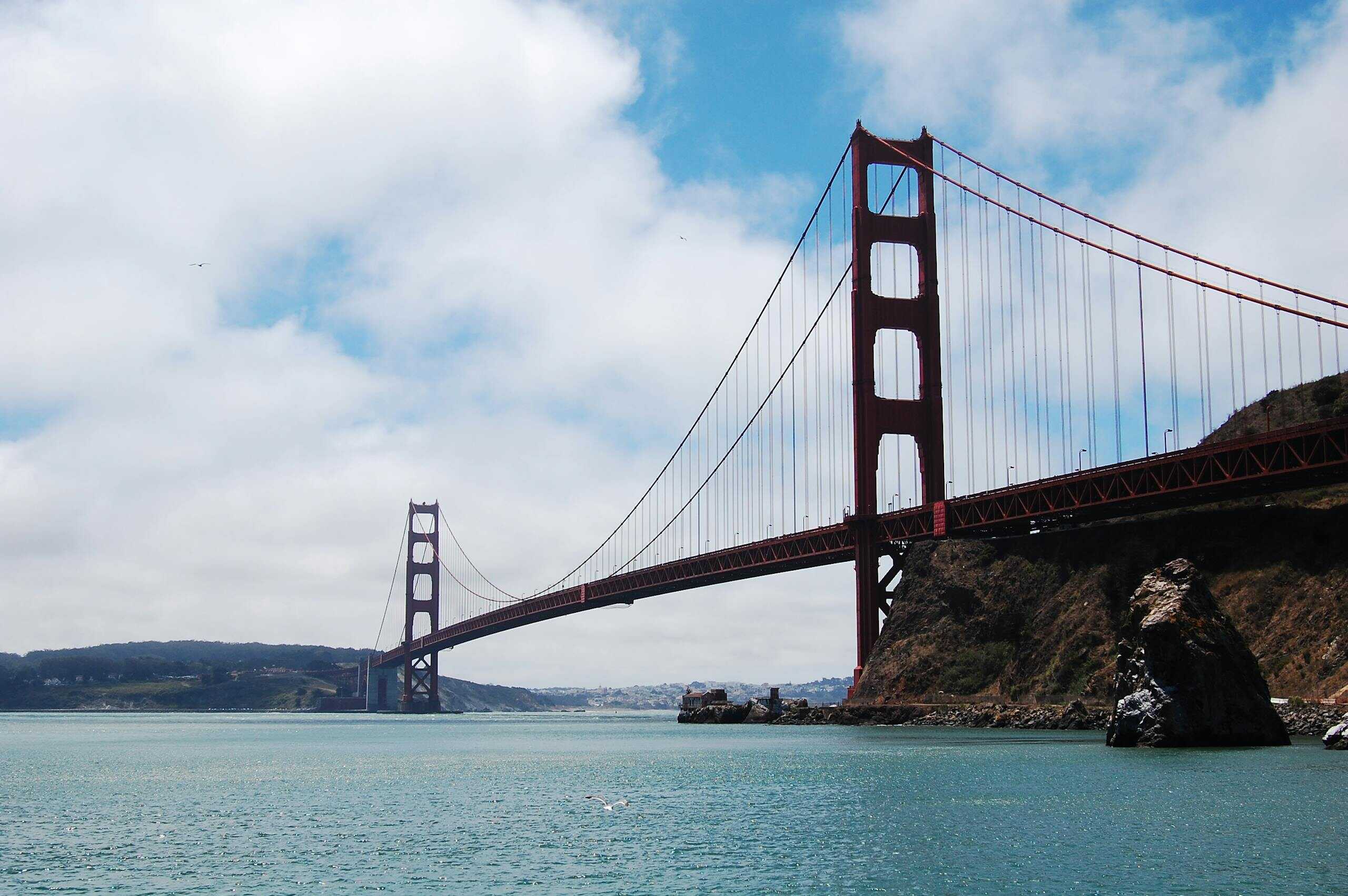Iconic view of the Golden Gate Bridge spanning San Francisco Bay on a clear day.