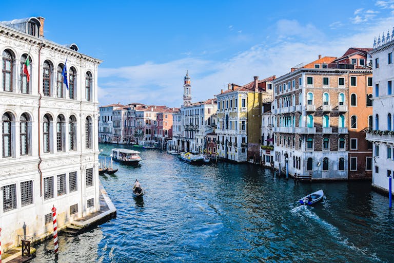 Beautiful view of the Grand Canal with gondolas and historic buildings in Venice, Italy.